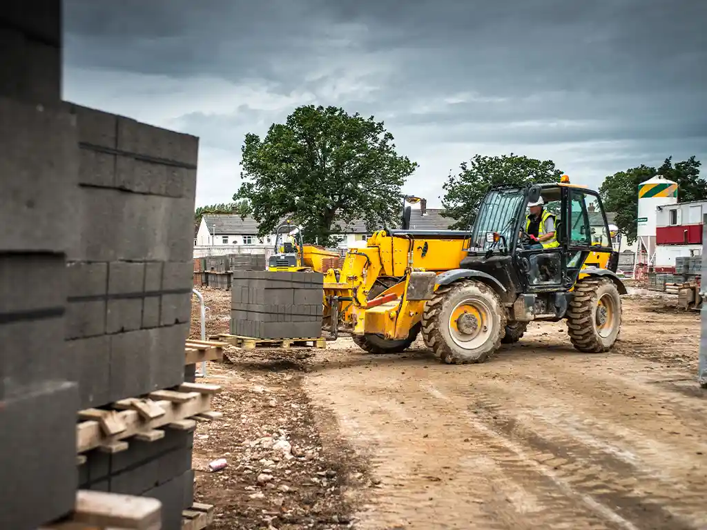 HU5_Blog_Featured_Images__0007_tractor building materials on construction site 2023 11 27 05 23 52 utc